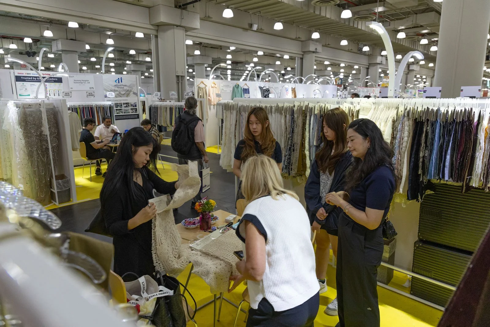 Texworld NYC attendees meeting with exhibitors at Javits Center