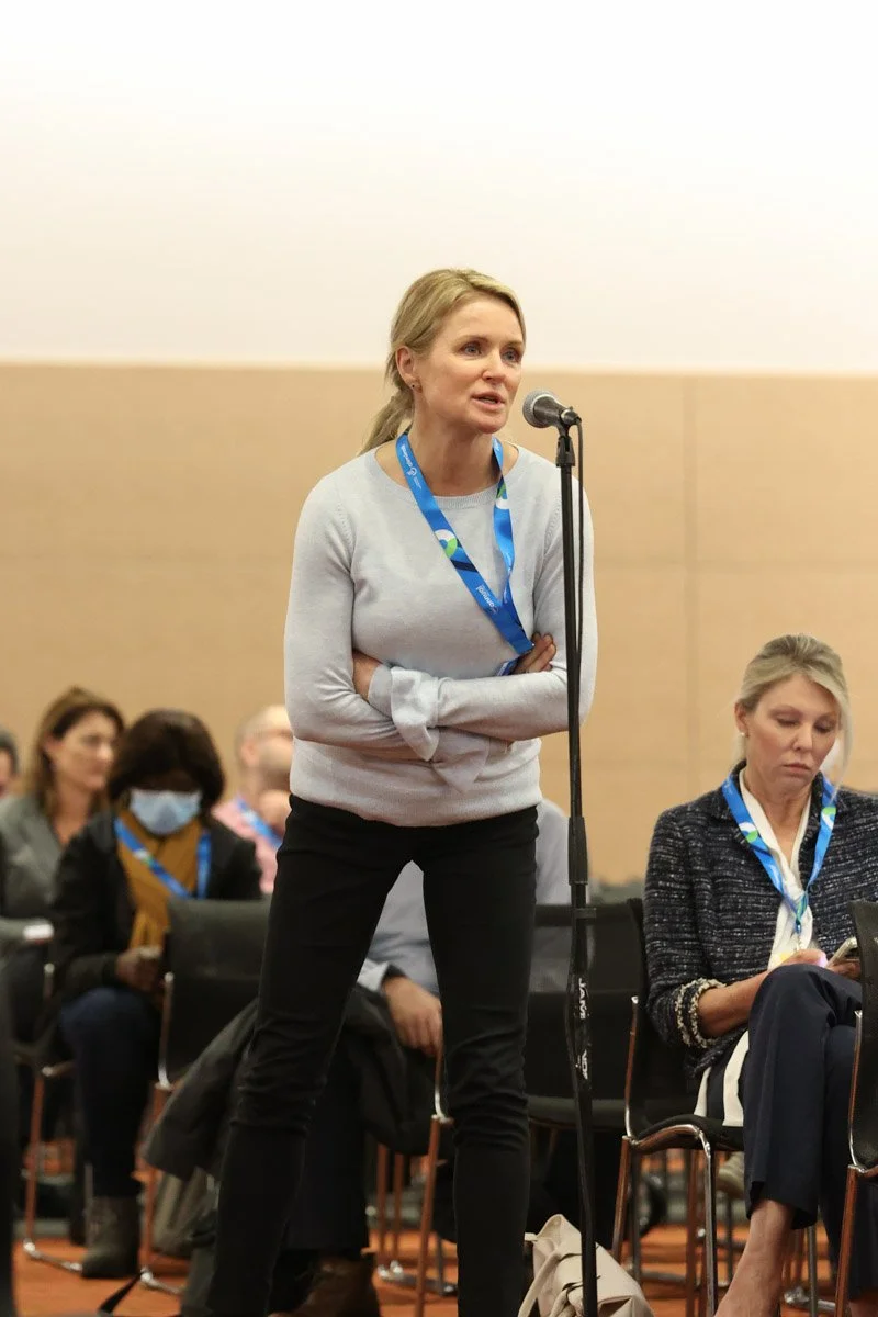 Corporate event guest engaging in Q&A session at the Boston Convention and Exhibition Center