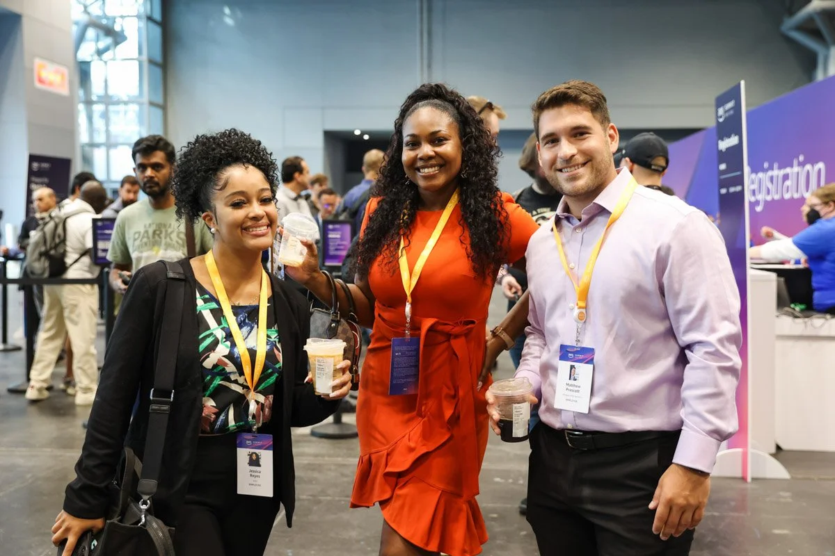 Busy corporate exhibitors showcasing technology solutions at the Amazon Web Services Summit at the Javits Center in New York City