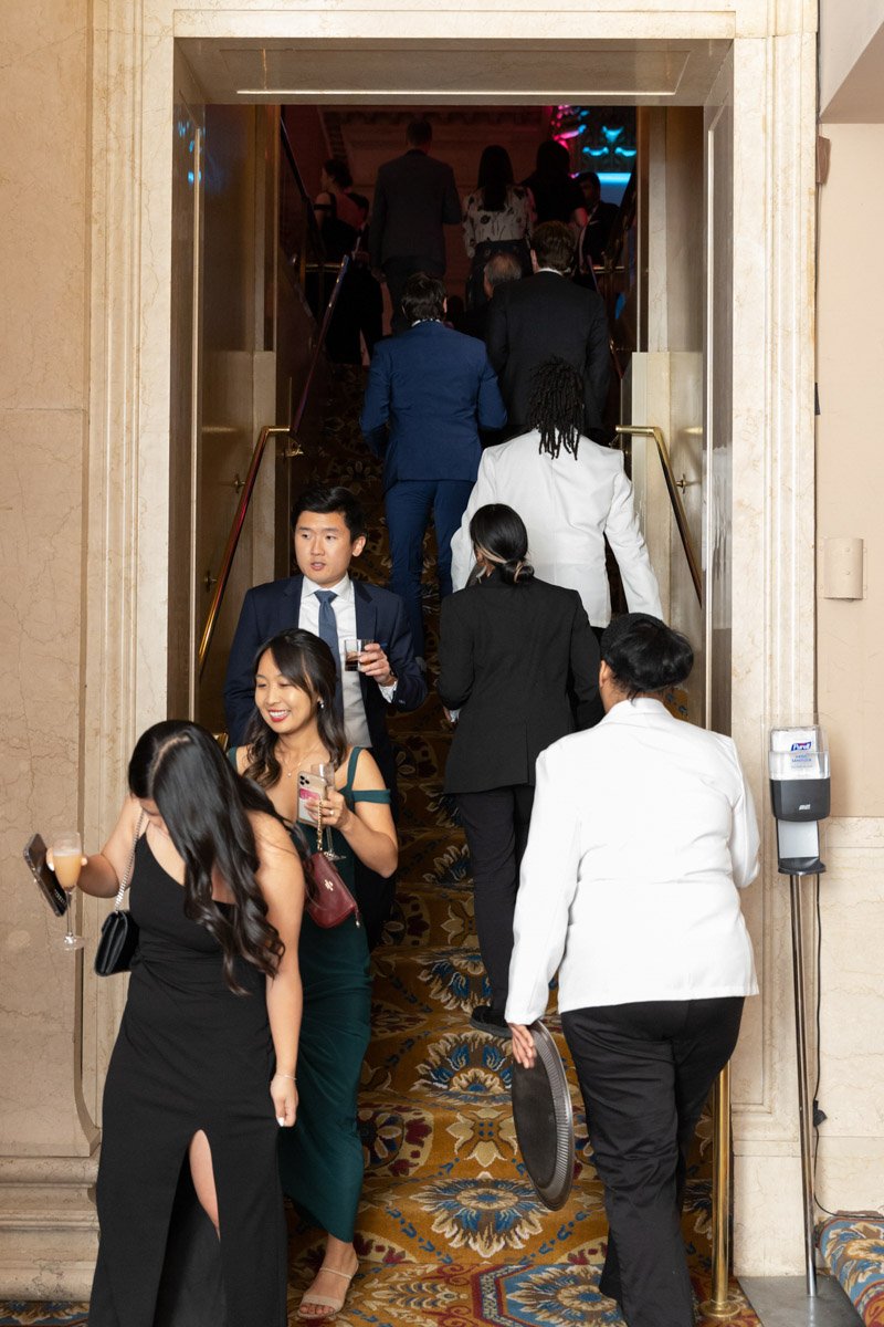 KACF Gala guests walking on a staircase at Cipriani Downtown Manhattan