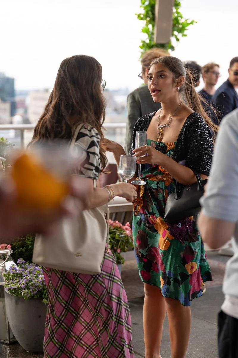 female professionals networking at rooftop venue in manhattan