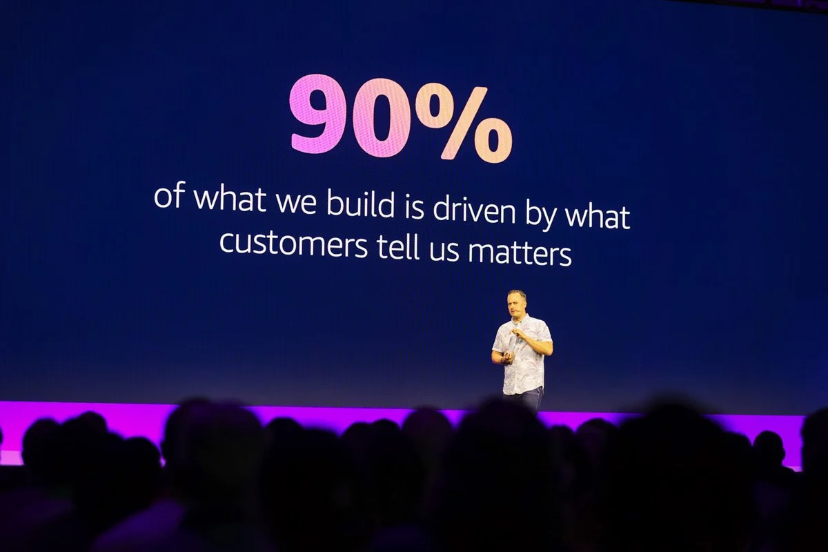 Industry leaders speaking on a panel at the Amazon Web Services Summit at the Javits Center in New York City