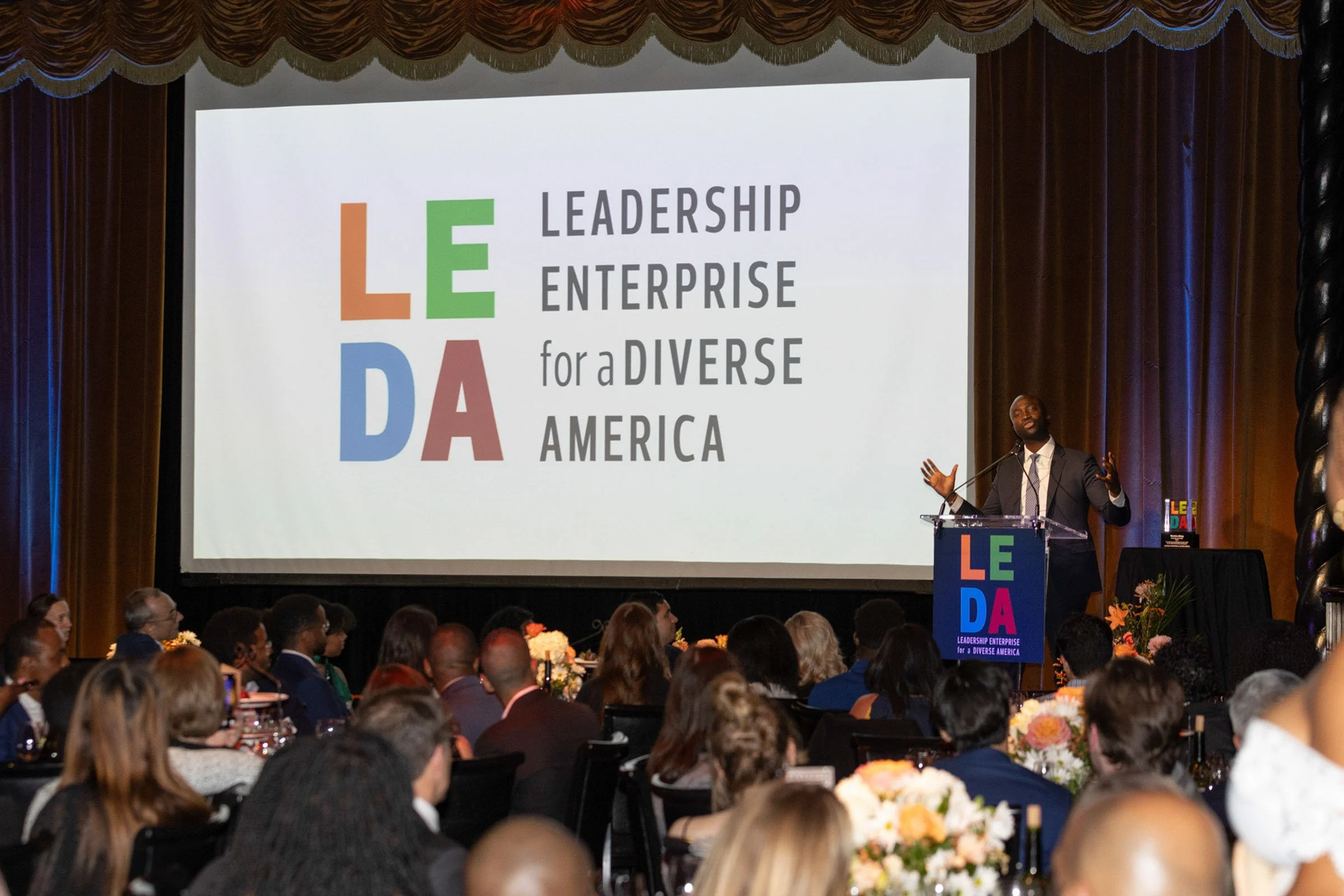 Corporate executive at a nonprofit keynote in new york city