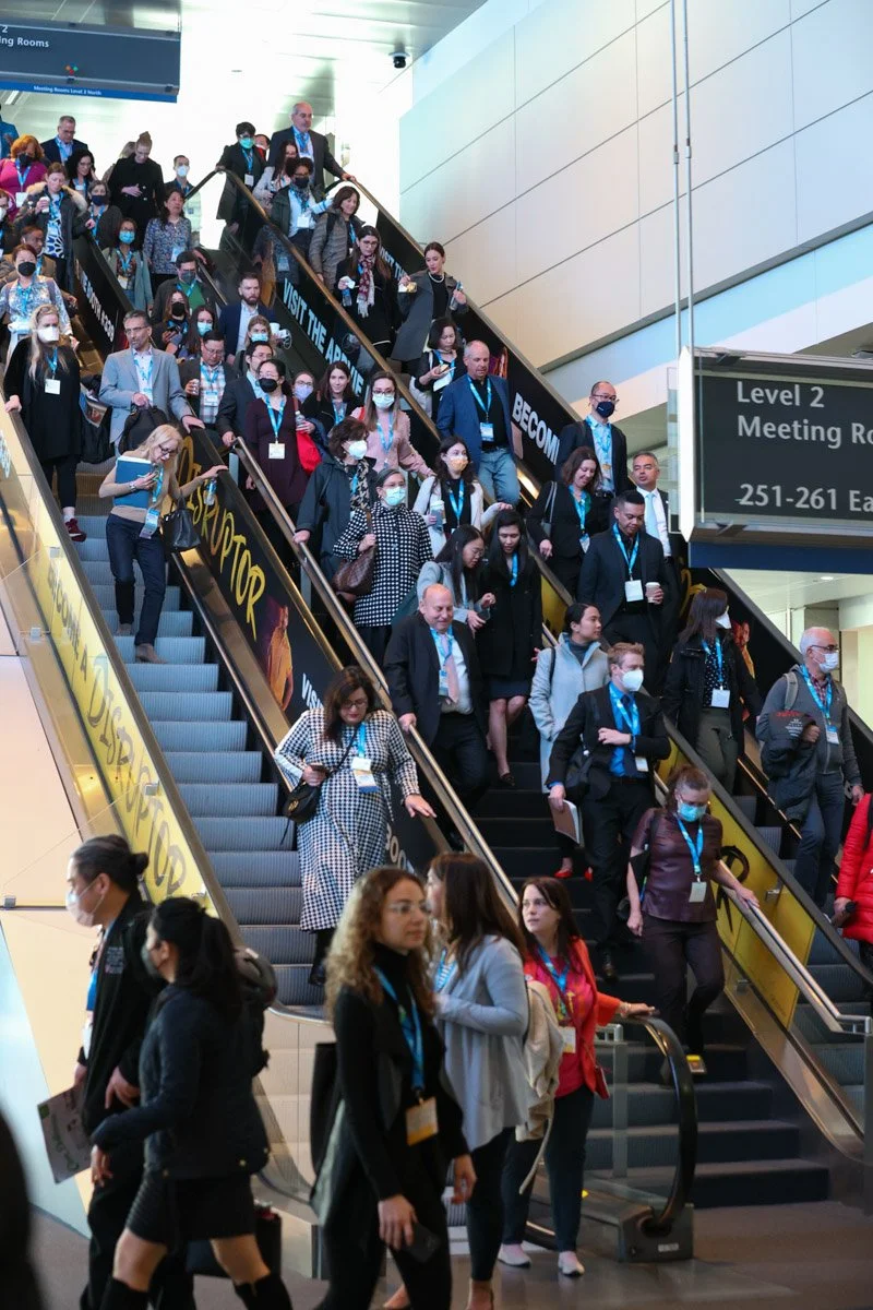 guests taking escalators at the Boston Convention and Exhibition Center