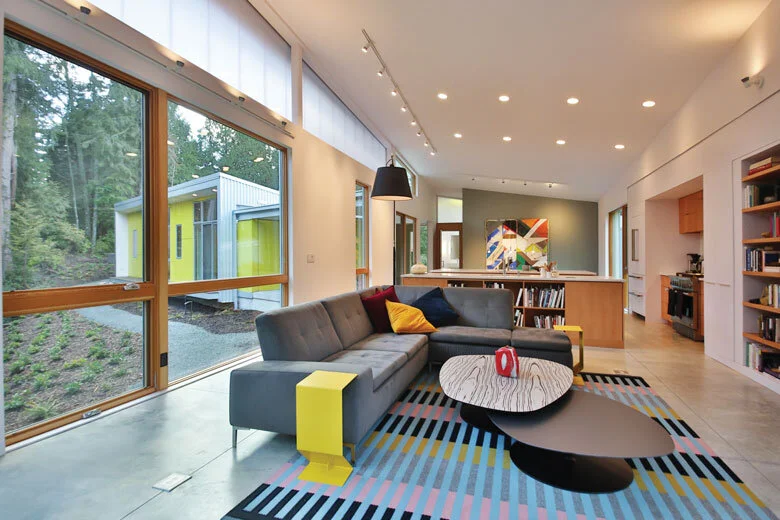 Image Credit: Michael StadlerTo keep the main house interiors low maintenance, Lenchek recommended concrete floors, white walls and warm tones.