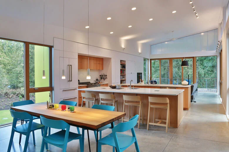 Image Credit: Michael StadlerAn open concept dining room, kitchen and living room creates a space owner Michael Howard says “feels really good to be in.”