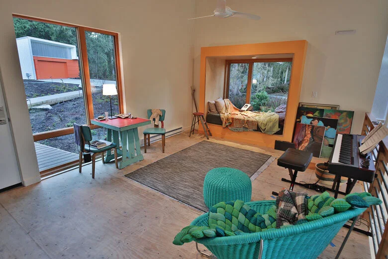 Image Credit: Michael StadlerA small lounging area in the loft of Jacobson’s studio provides space to relax and reflect.