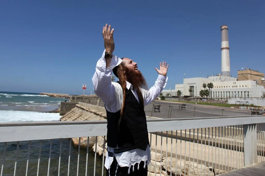 Rav Dror praying by the Mediterranean Sea