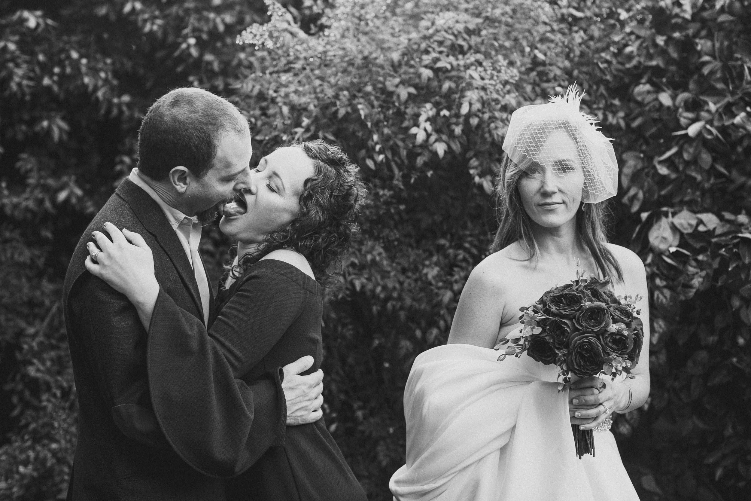 Ironic moment as passionate couple makes out next to nonplussed bride at Parker Palm Springs