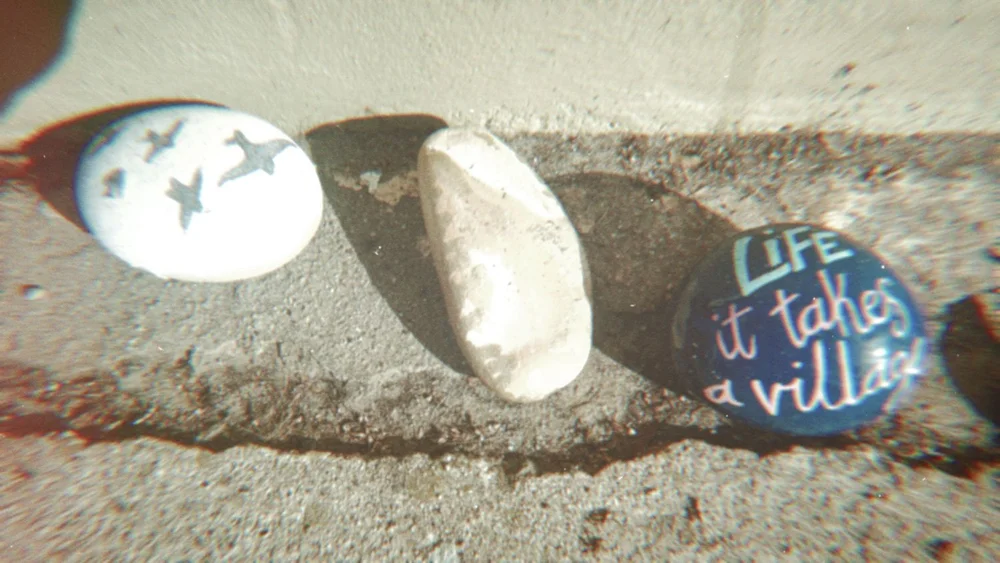 Painted rock art on sidewalks in Carpinteria, California