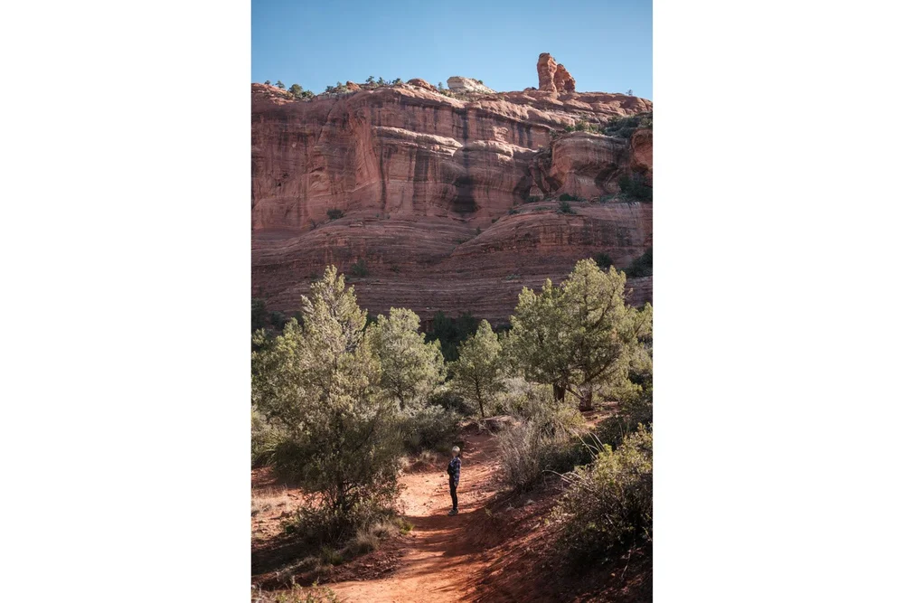 Subway Cave Trail posing with rock cliffs in background