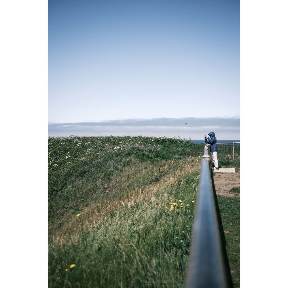 Oregon Yaquina Head Lighthouse taking a photo in windy day