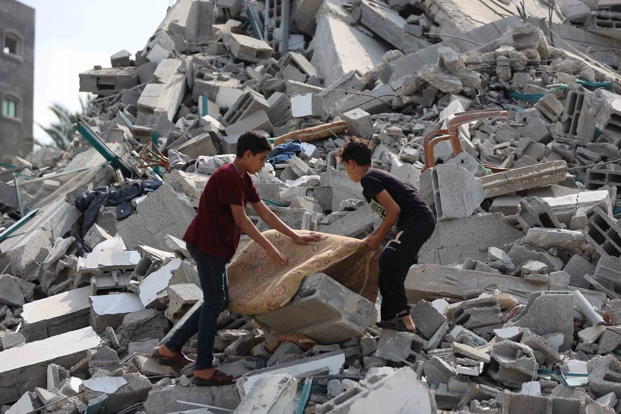 Children searching rubble in Gaza