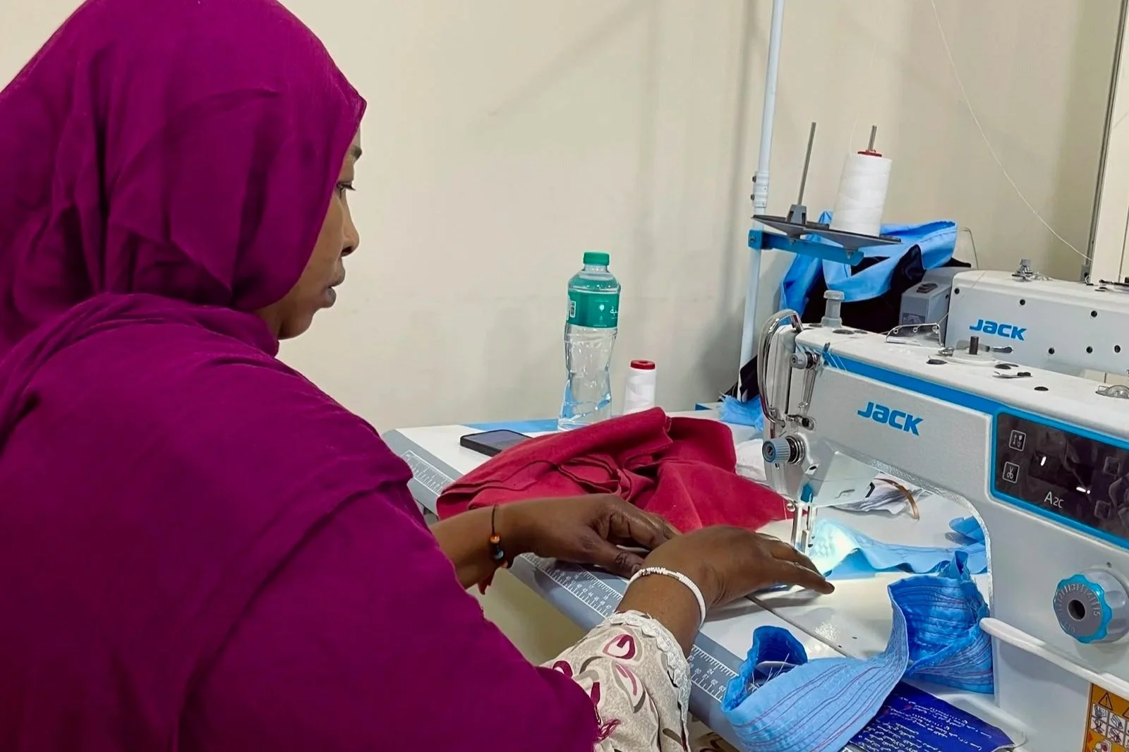 Sudanese refugee learning tailoring skills
