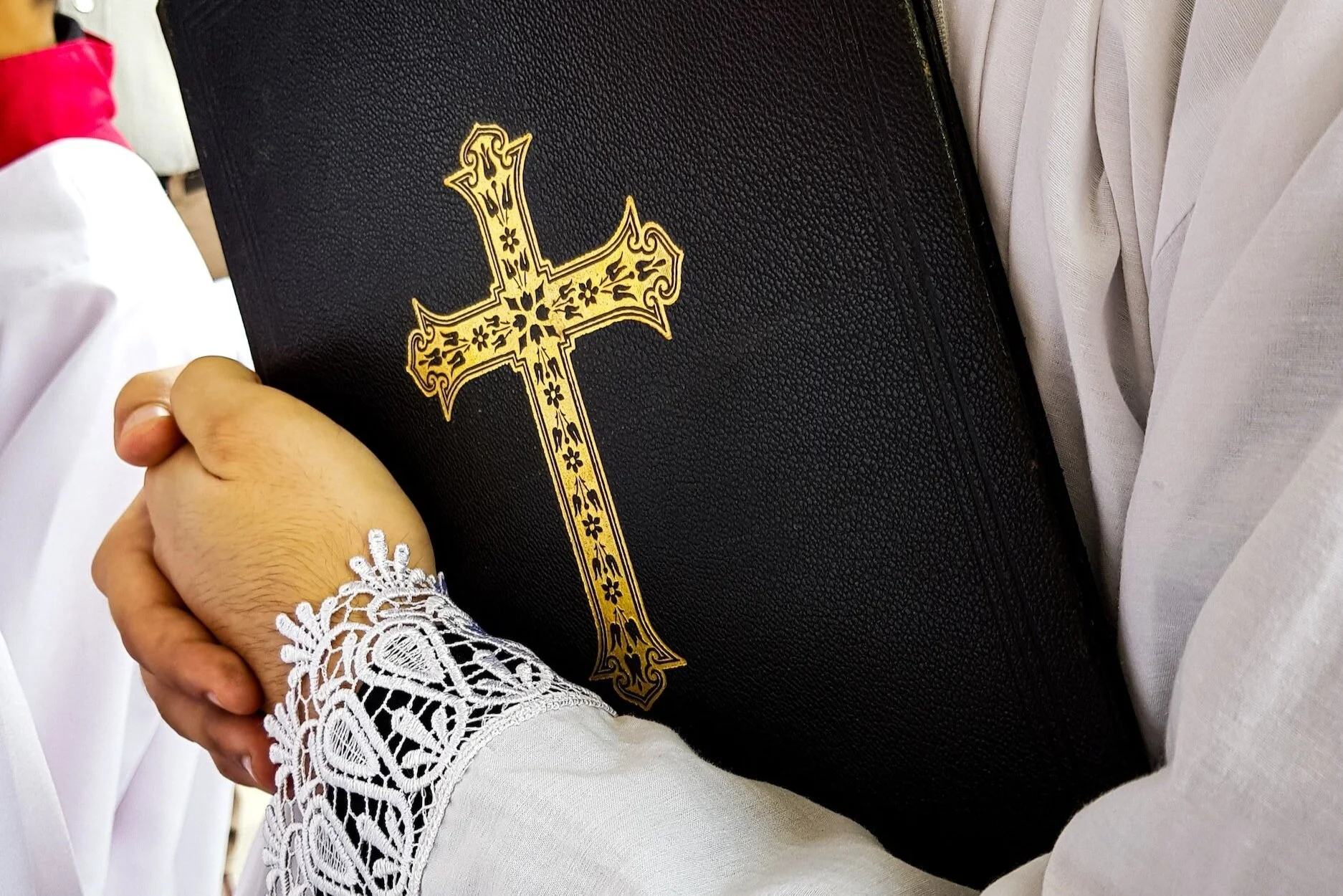 Clergyman holding a bible