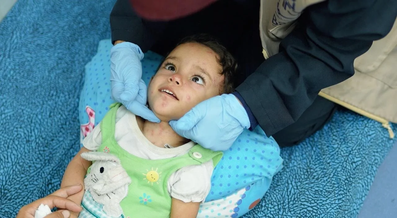 Hana receiving treatment at the JPBC unit in Gaza