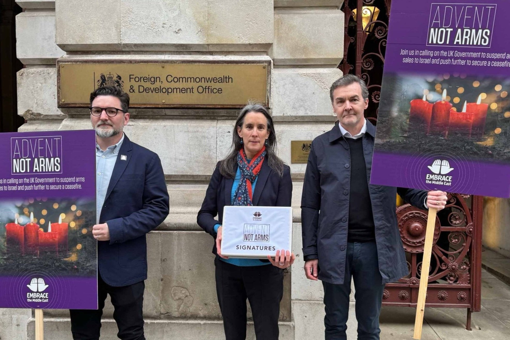 Embrace staff handing in petition at FCDO
