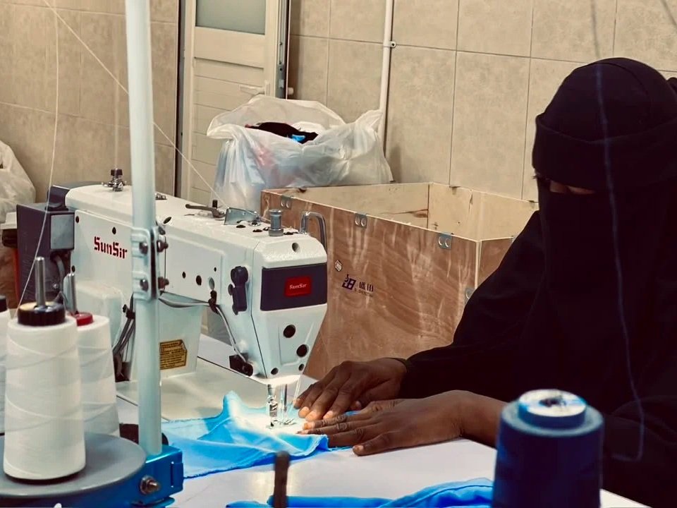 Woman sewing at a sewing machine