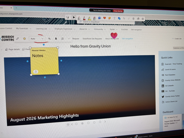 A photo of s screen monitor with an annotation onscreen, on top of a SharePoint site