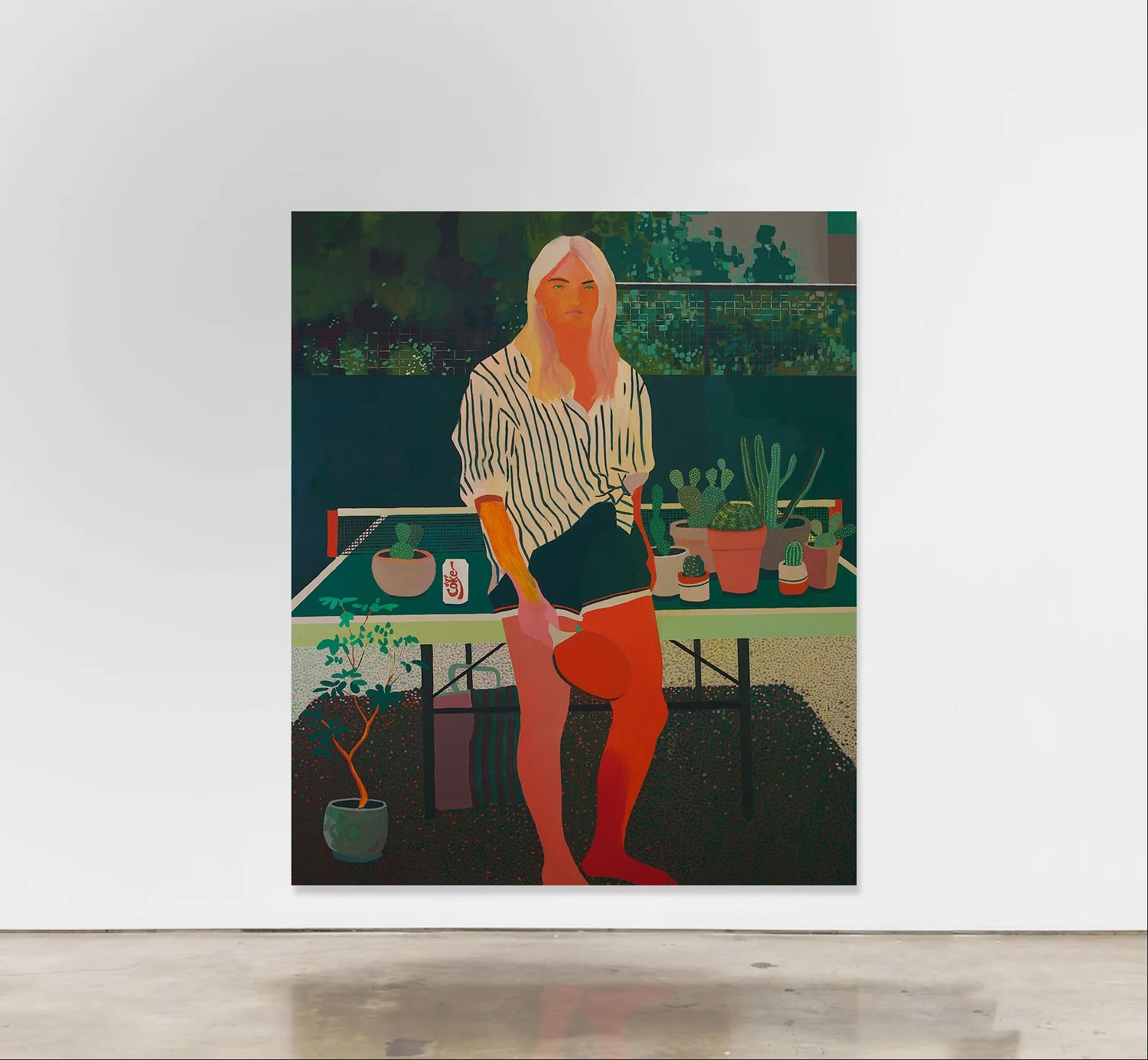 Installation view of a painting of a standing figure with a table of potted plants, on a white gallery wall.