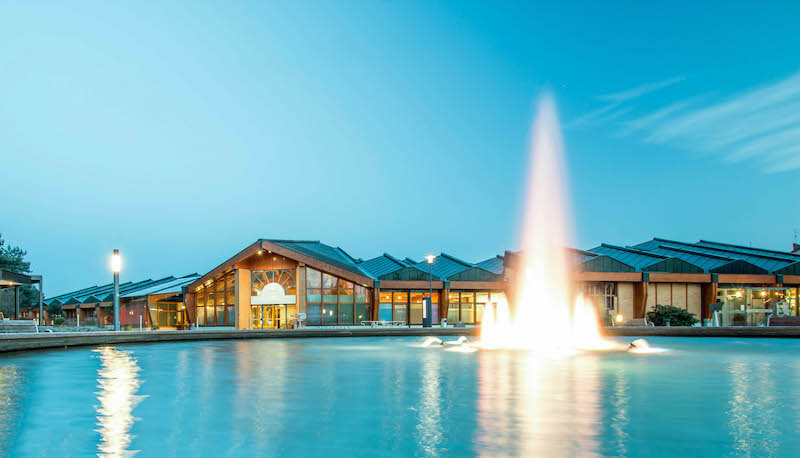 Asian woman pouring nude body with water before the pool