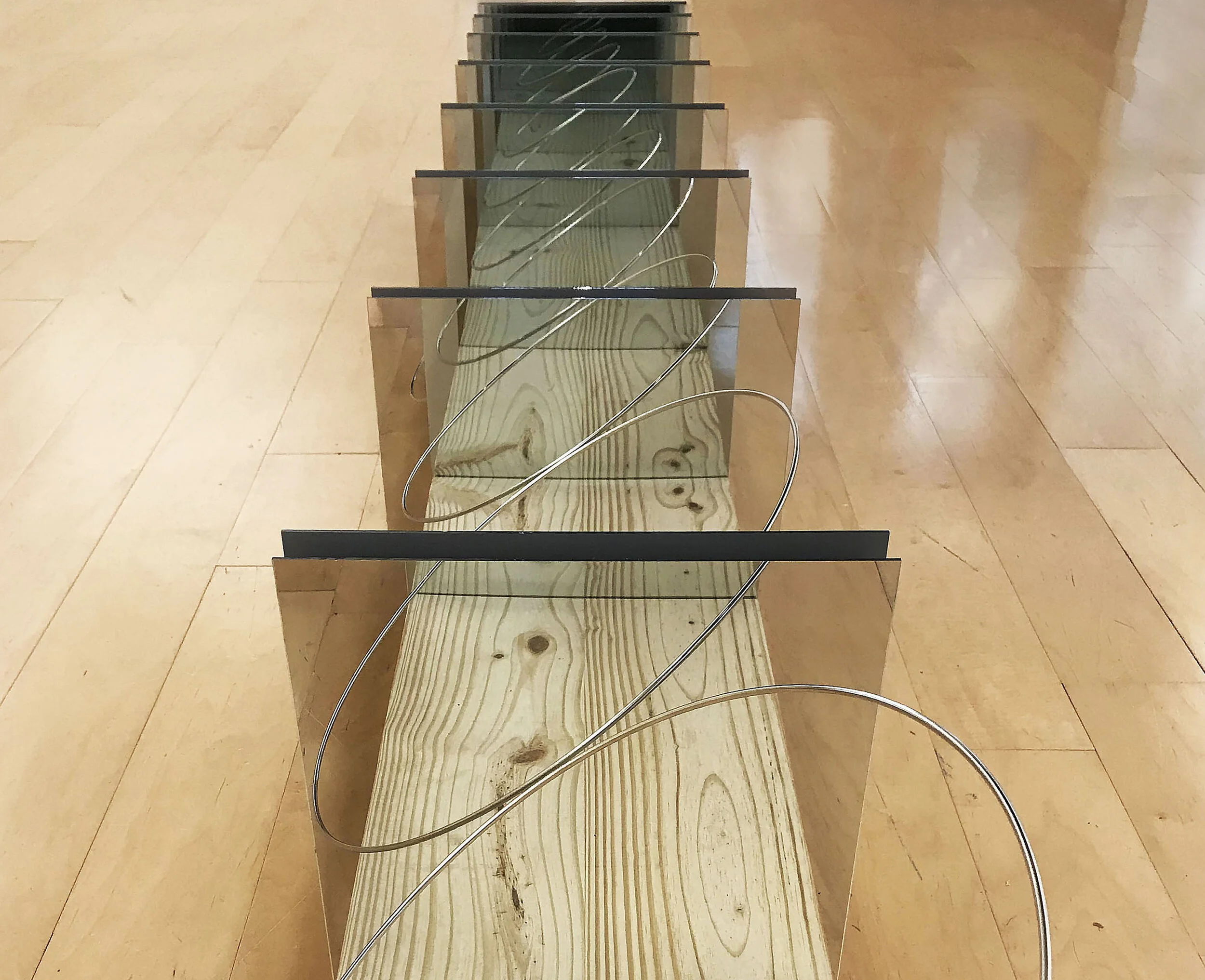 Lacunas, 2019Mirror, Magnet, Metal Rings, Wood Panel
