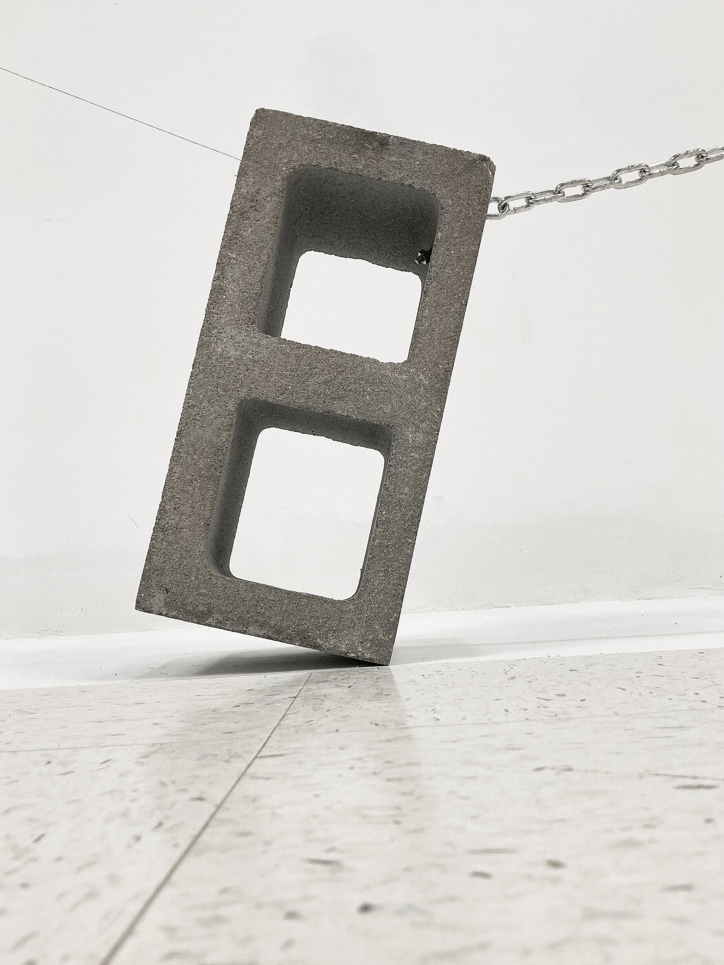Concord, 2020Concrete block, Chain, Magnet, Needle, Fishing line