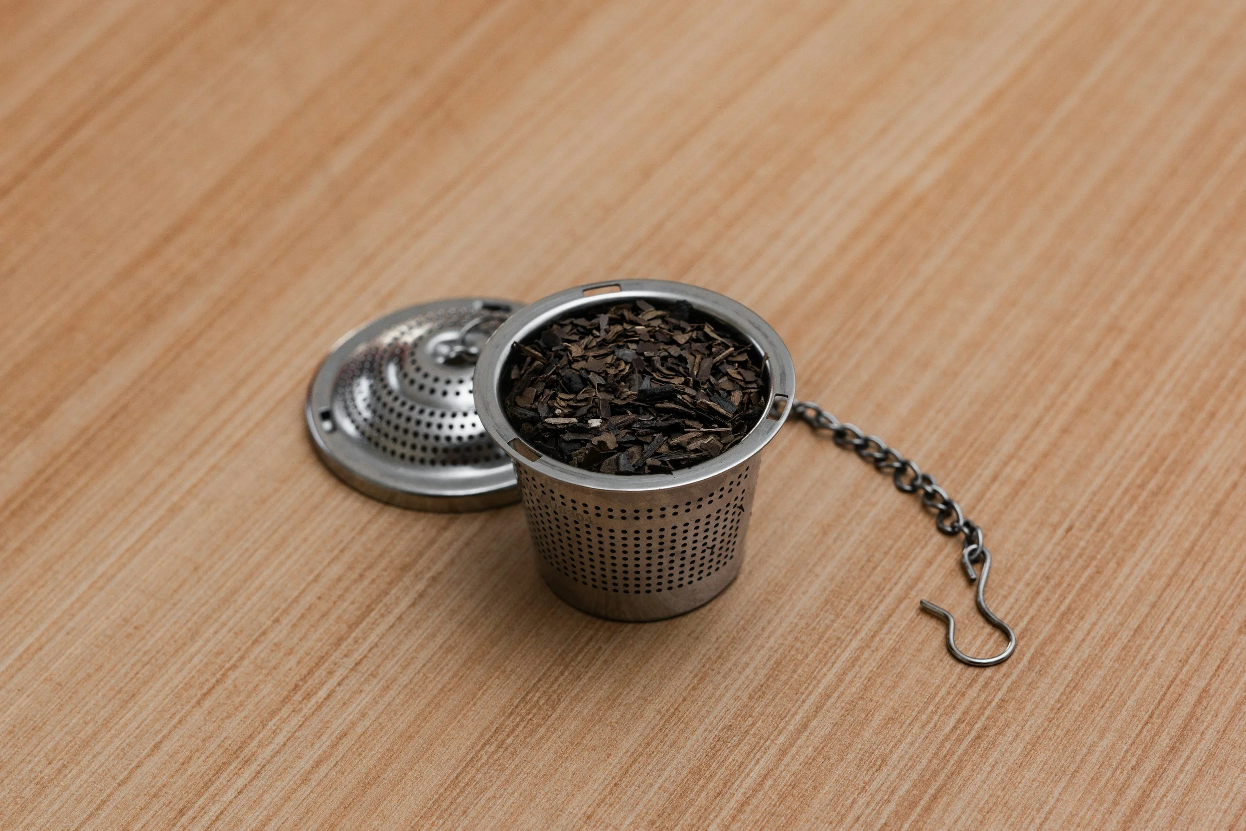 Loose tea leaves in an infuser