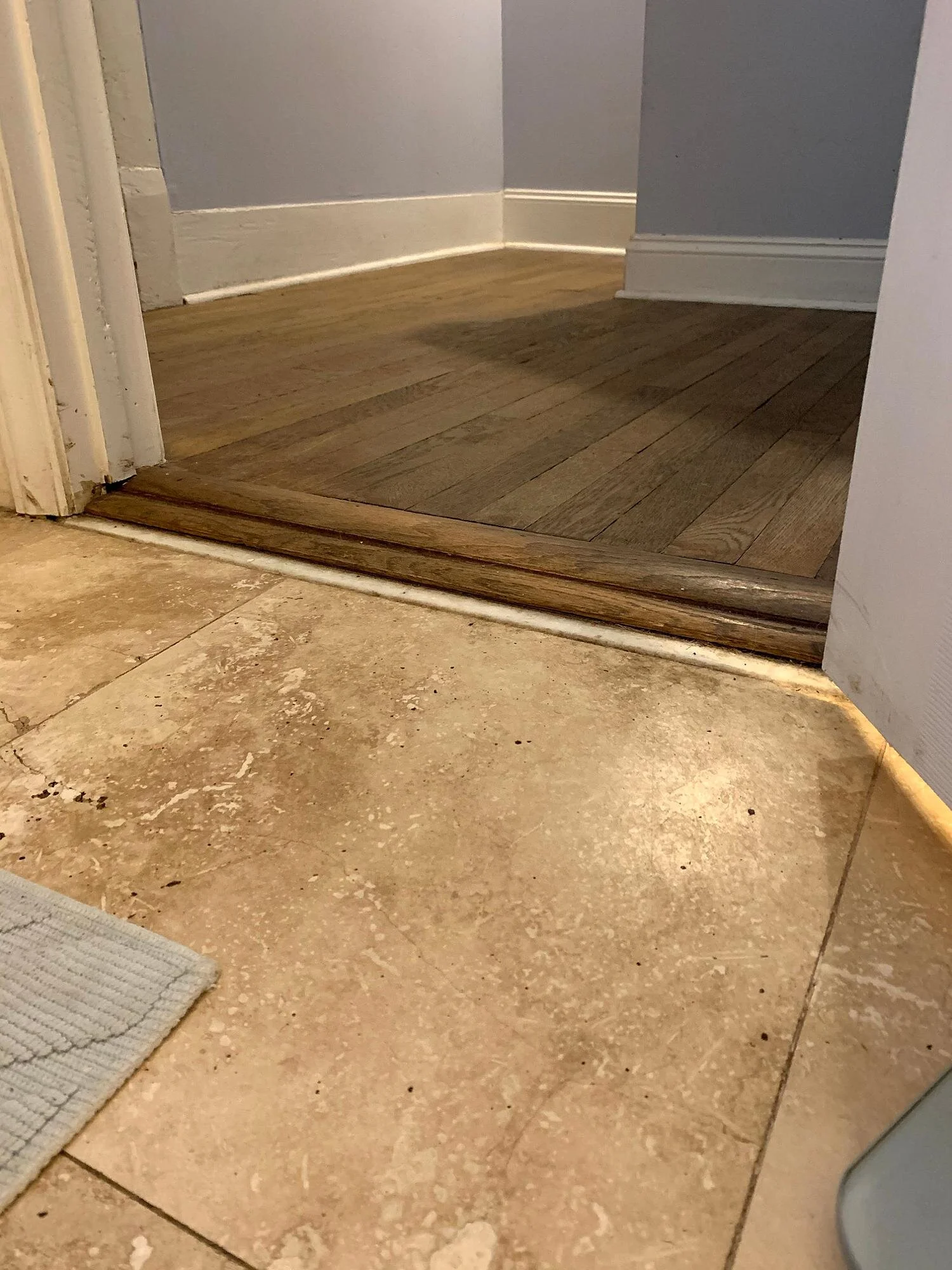 Another awkward transition into from the hallway into the bathroom.