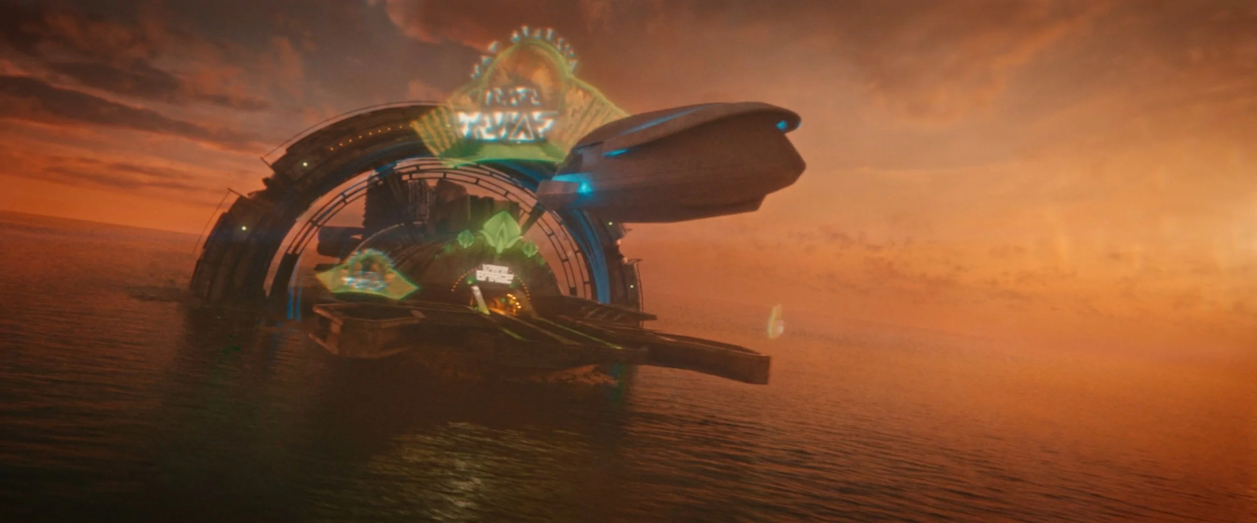 A futuristic spaceship flying over water against a sunset sky with orange and yellow clouds.