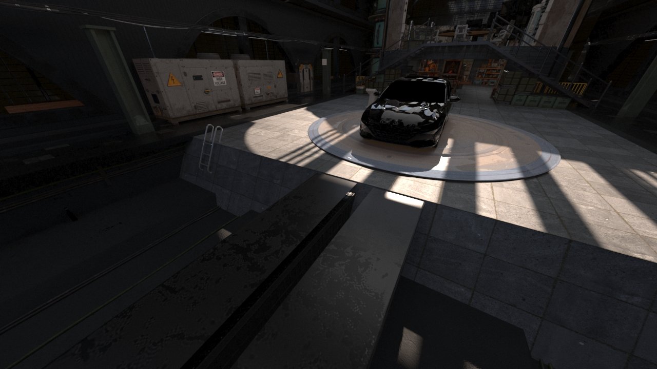 A black car parked on a circular platform in an industrial-style indoor space with concrete flooring and metal stairs.