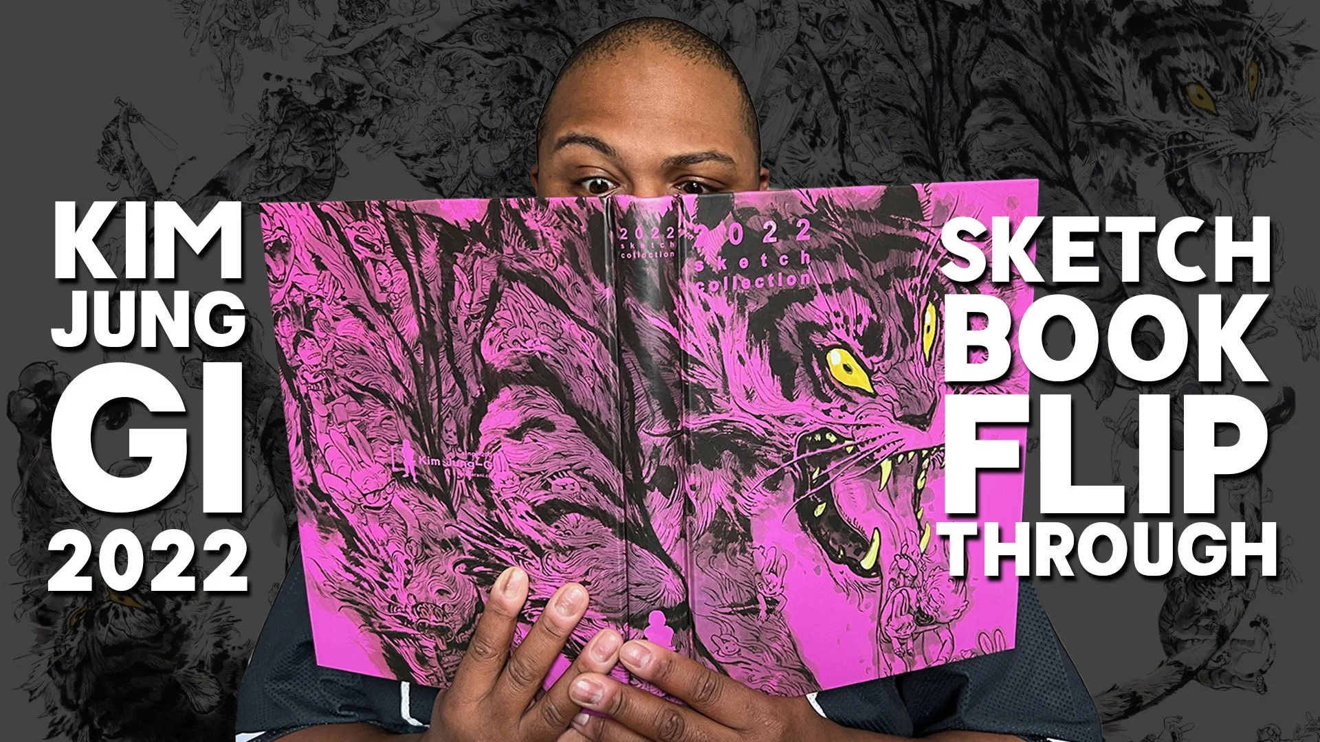 Person holding an open Kim Jung Gi sketchbook with a vibrant pink and black drawing of a tiger's face, with overlapping text indicating it is a 2022 collection. The background features a dark, detailed sketch of various figures and art styles.