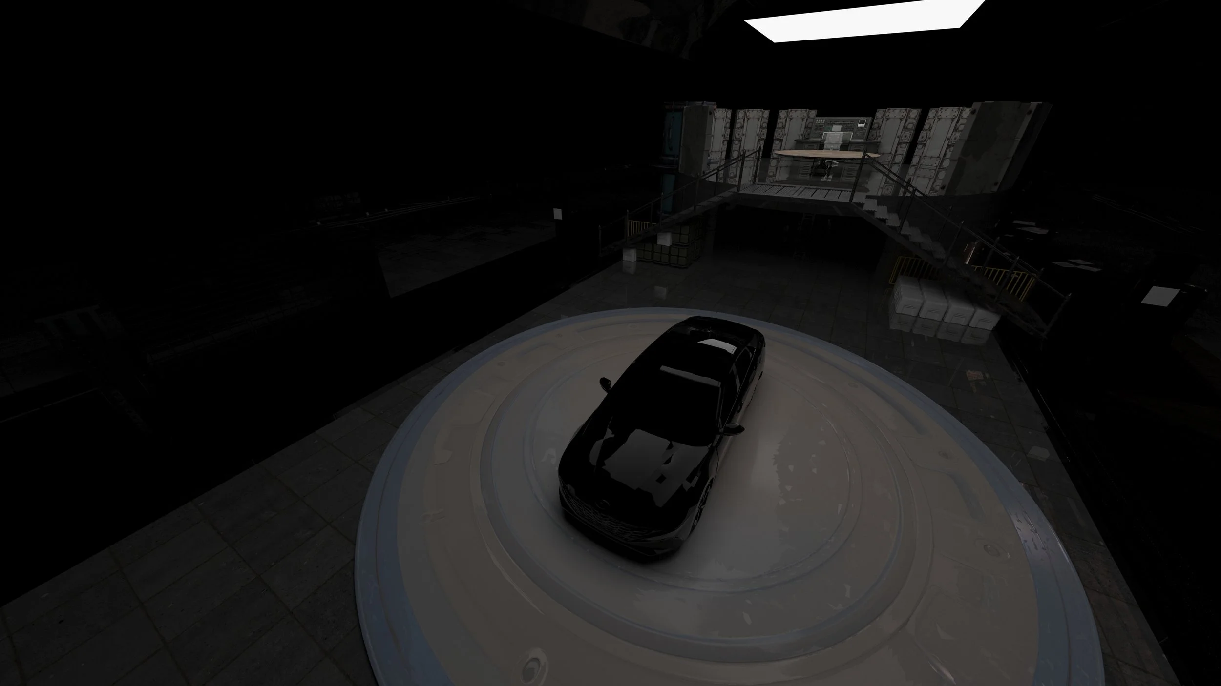 A black car is parked on a circular platform inside a dimly lit industrial or warehouse-like space with metallic structures and a staircase.