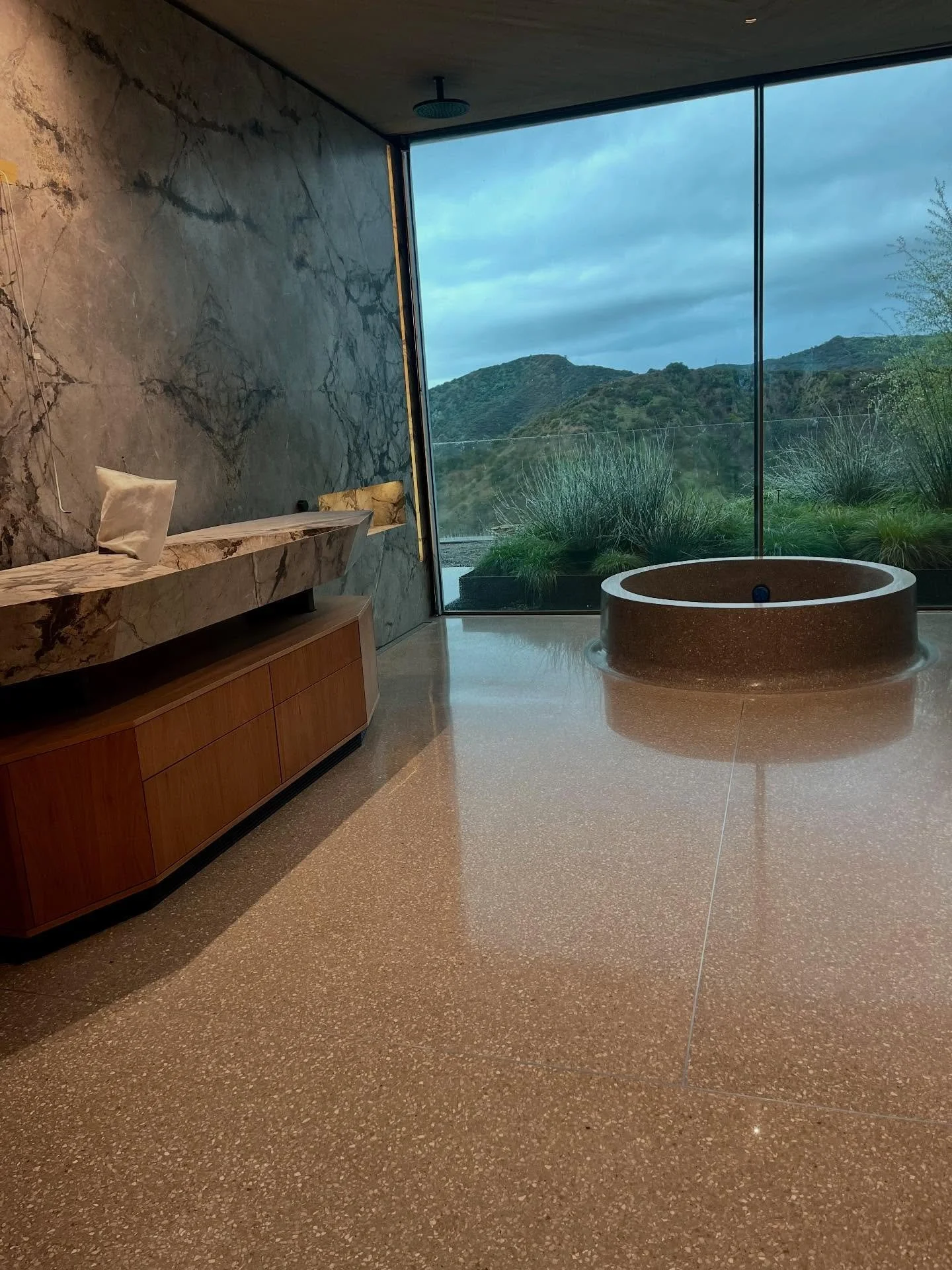 A true work of art, this terrazzo tub deserves a post of its own. 🛀 

Seamlessly connected to the terrazzo floors throughout this home, the design flows from surface to structure, blurring the line between architecture and design. 

A custom stateme
