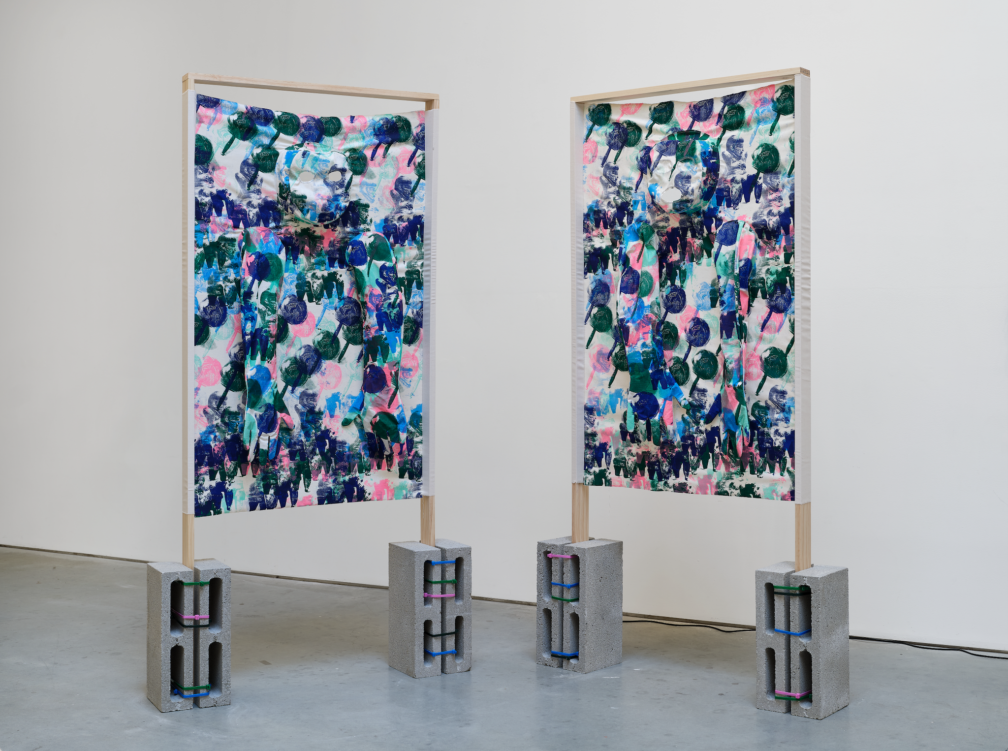 Mangas Para Teletransporte (Sleeves to Teletransport) 2025 Screen printed textiles, foil thread, wood, cement blocks
