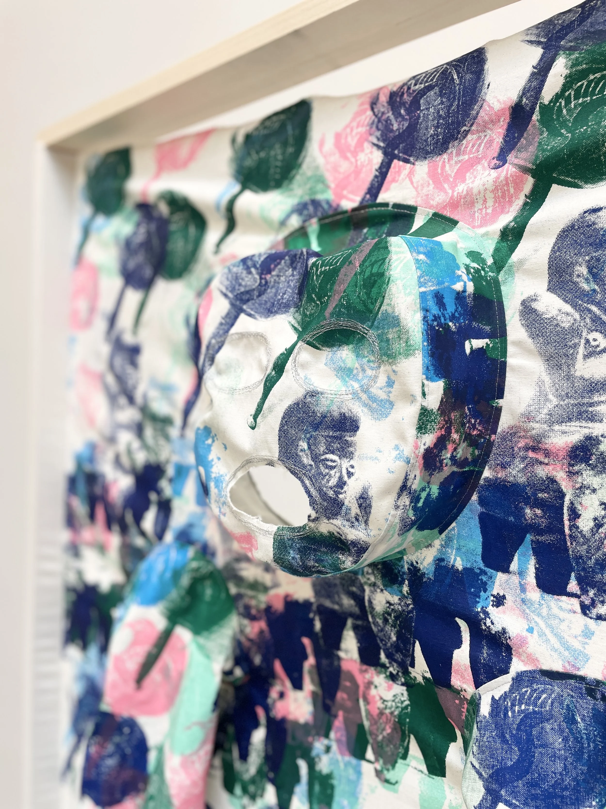   Mangas Para Teletransporte (Sleeves to Teletransport), Detail shot   2025  Screen printed textiles, foil thread, wood, cement blocks 