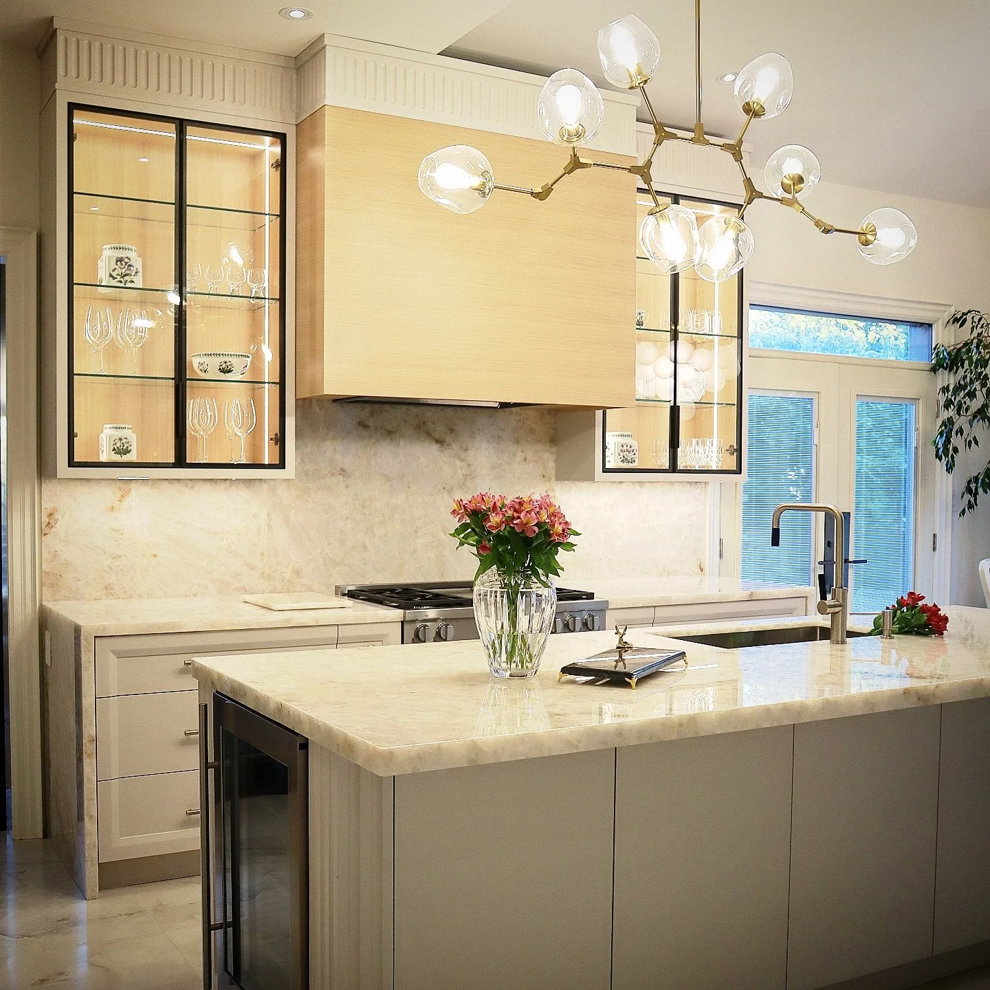 Combo of quartzite, oak and solid brass never gets old! #woodbridge #customkitchen #interiordesign