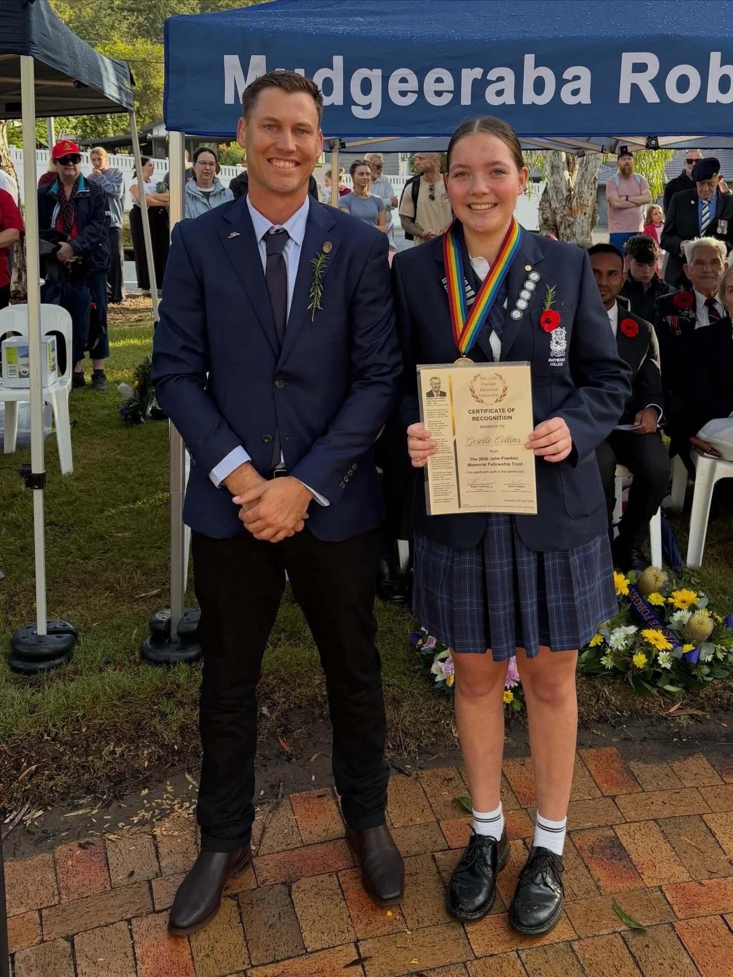 Each year on Anzac Day at the sunset service we set aside some time for a series of community initiatives at the generous invitation of the Mudgeeraba Robina RSL Sub Branch. We unveil a number of plaques outlining military service for members of loca