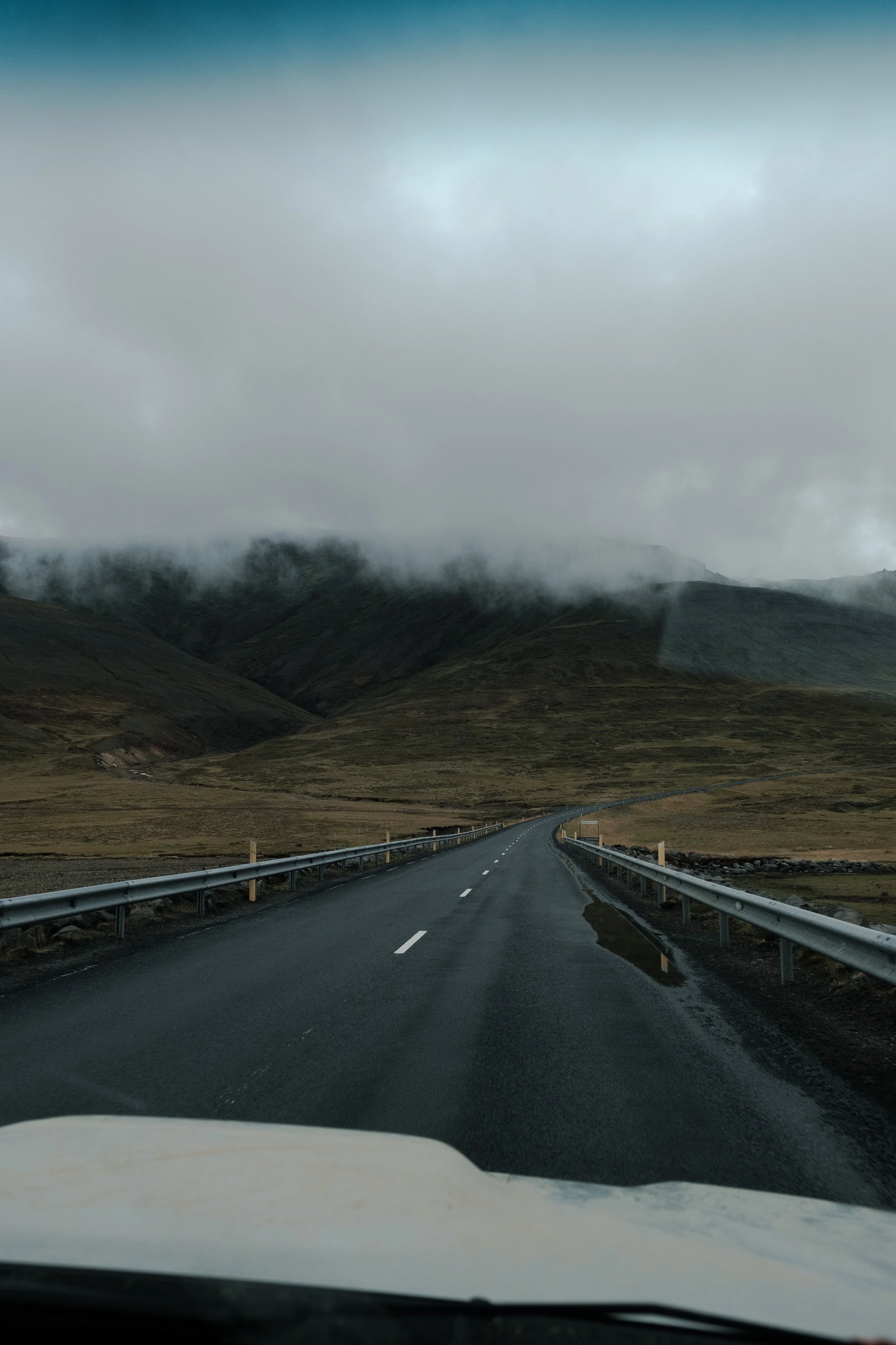 Road and mountains covered with clouds in Iceland