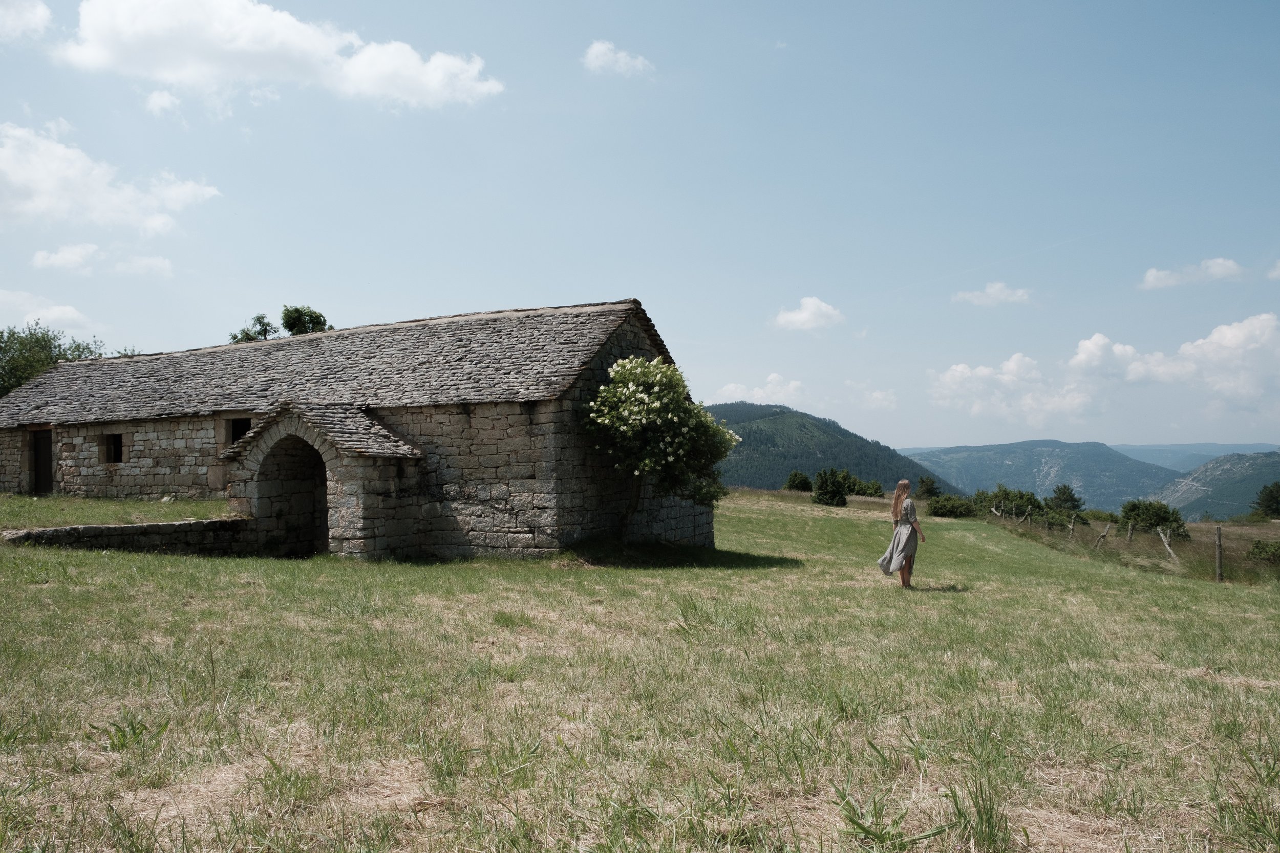 Woman standing in French countryside 