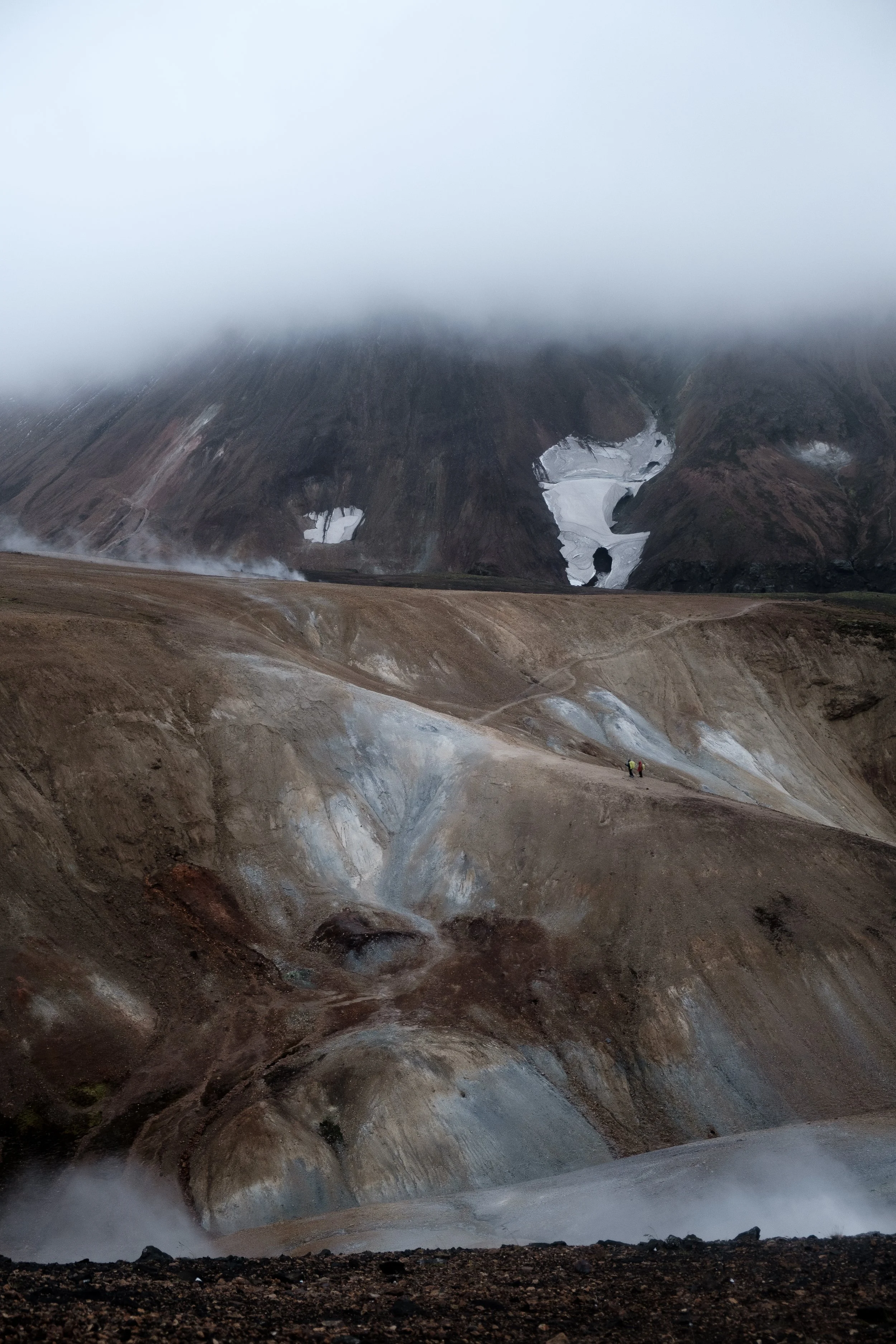 Volcanic mountains in Iceland covered with some snow, ice and clouds 