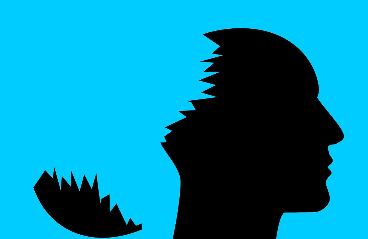 silhouette of a head on a blue background