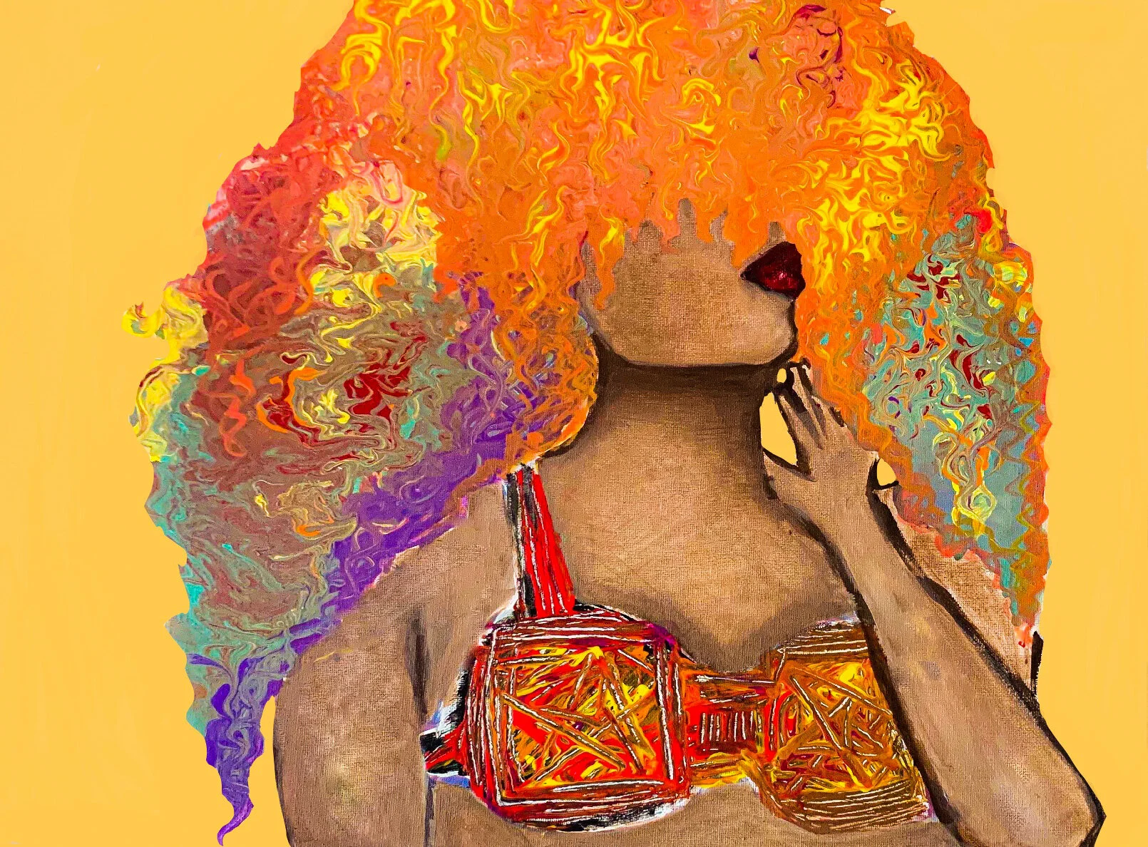 A woman with voluminous, curly hair in rainbow colors including orange, red, yellow, purple, and blue. She is wearing a colorful, patterned top with red and yellow tones. She is posing with her hand near her face, against a plain yellow background.