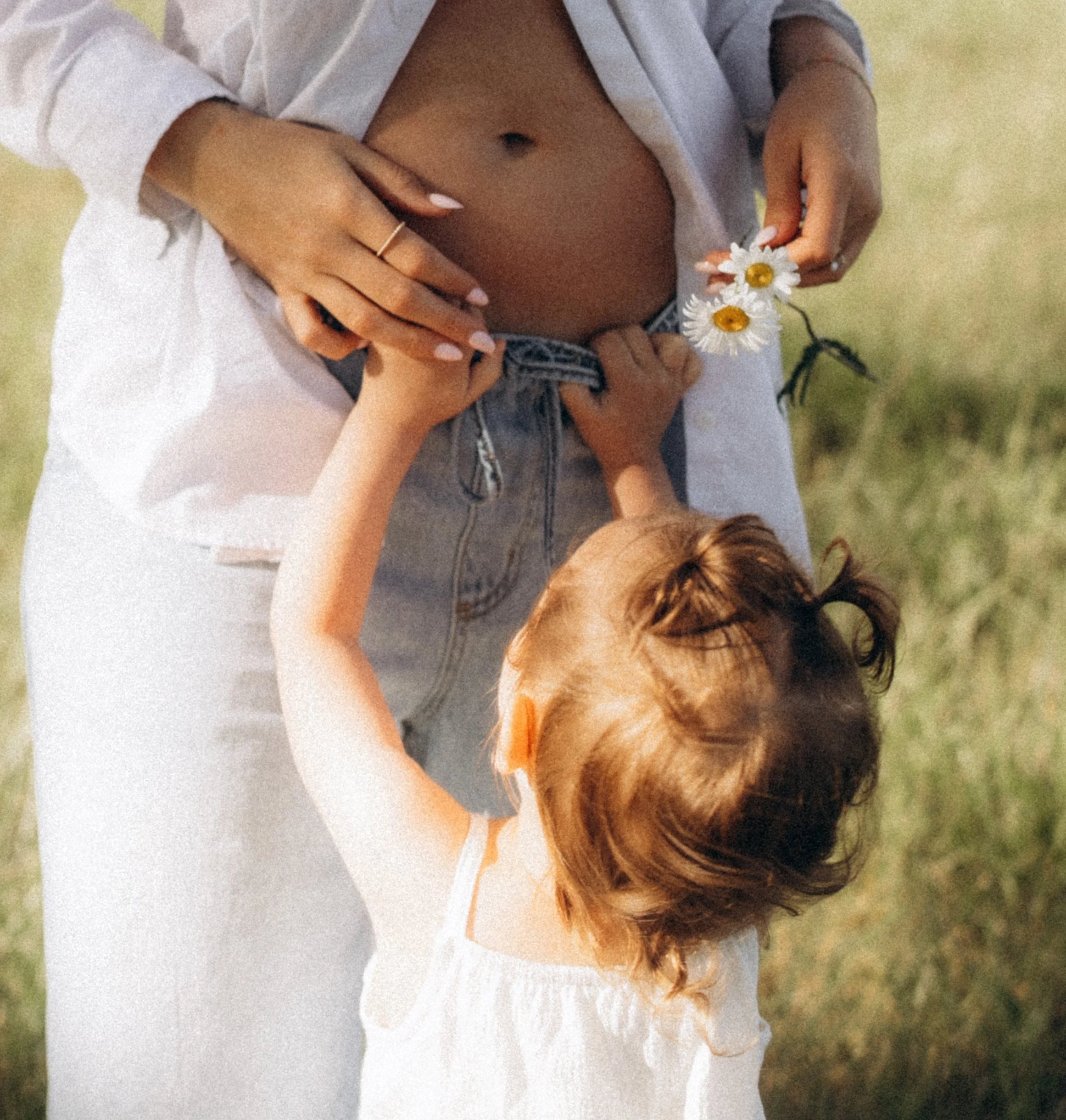 Mother cuddling toddler during a morning family photography session in Rogersville Missouri