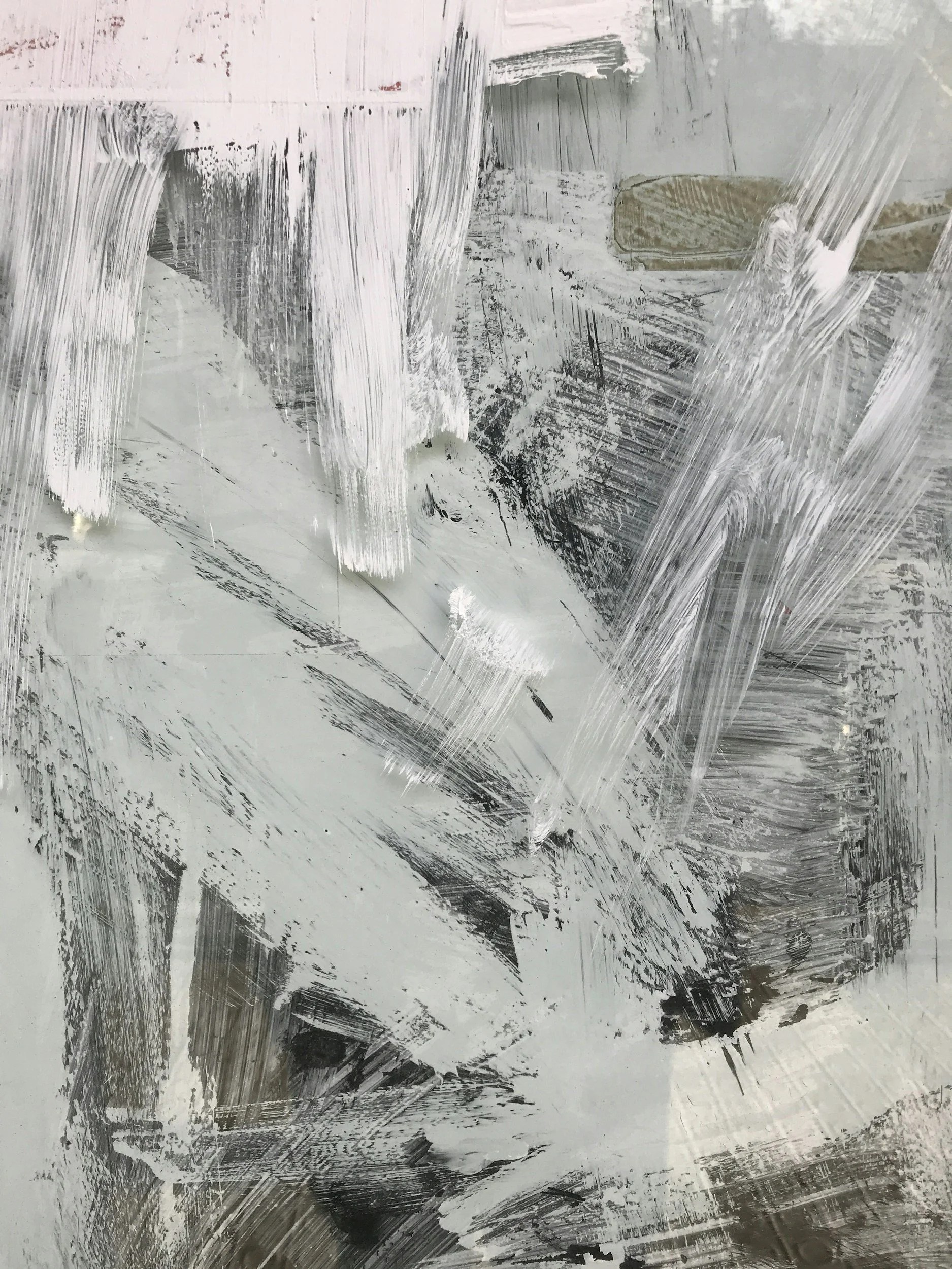 A abstract painting with white and black paint strokes and smudges covering it, creating an abstract, textured pattern.