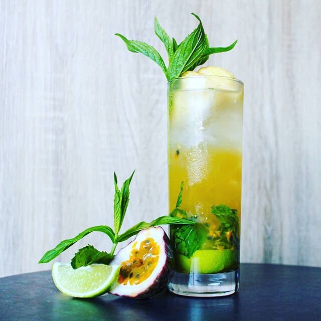 HELP US NAME OUR COCKTAIL!? A delicious mix of rum, passionfruit, mint and lime. All tied together with a mint sprig and passionfruit sorbet for a garnish! 
For those who want to make it at home.

2 Oz captain Morgans
1 Oz lime juice
.75 Oz simple sy