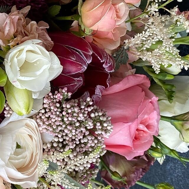 Sneak Peek of this weeks wedding  bouquet!  I LOVE the colors and texture in this one!  Hoping the bride lives it too! #bridalbouquet #smallwedding #weddingbouquet  #gardenroses #ranunculus #riceflower #protea #coral #peachroses #iowaflorist  #iowawe