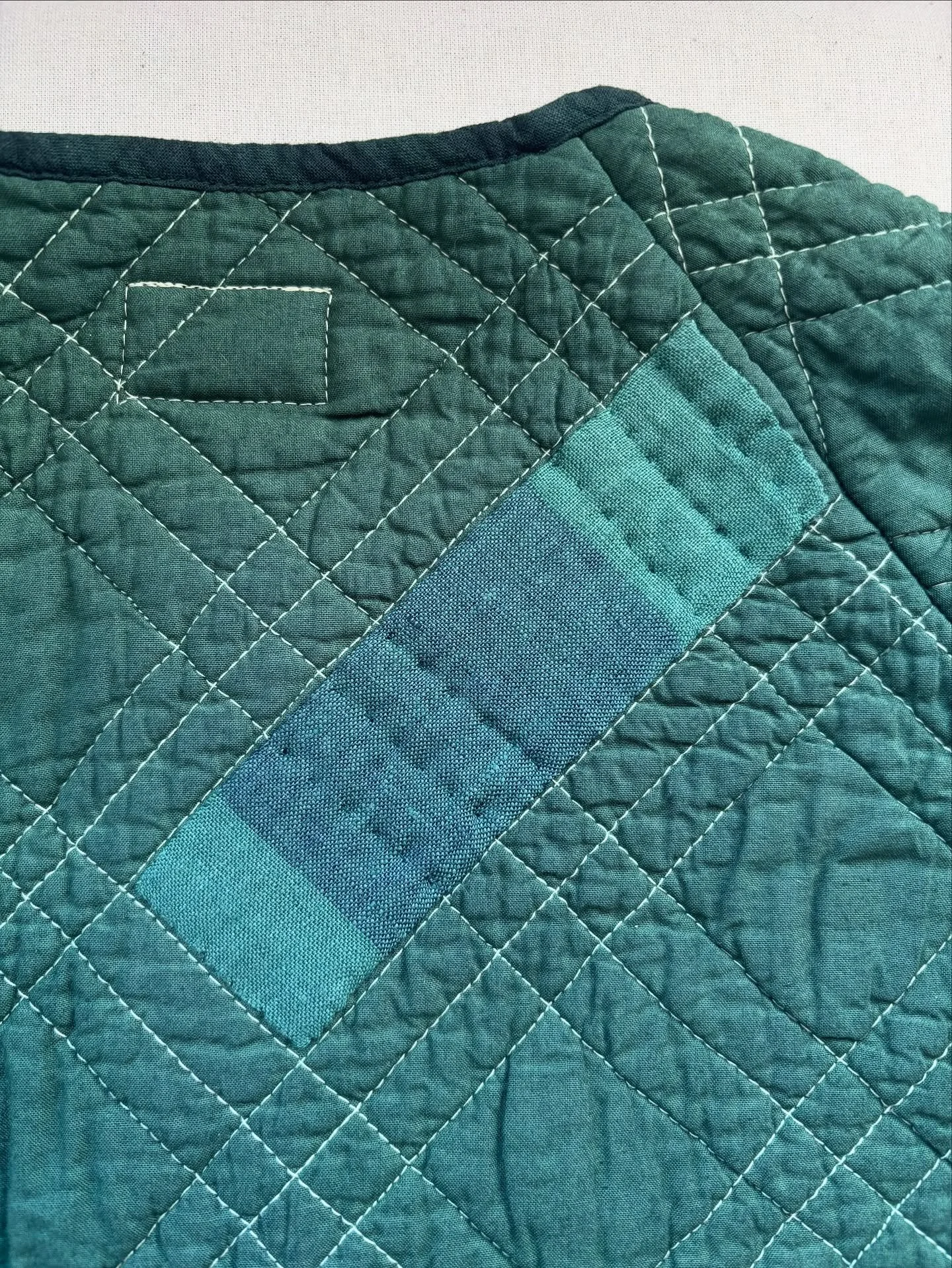 Working with pre loved textiles means that I have to get creative with mends. When I dyed this quilted bedspread jacket, there were some marks that showed up after dyeing. This sweet little patch hides its sins. I love how individual each piece is an