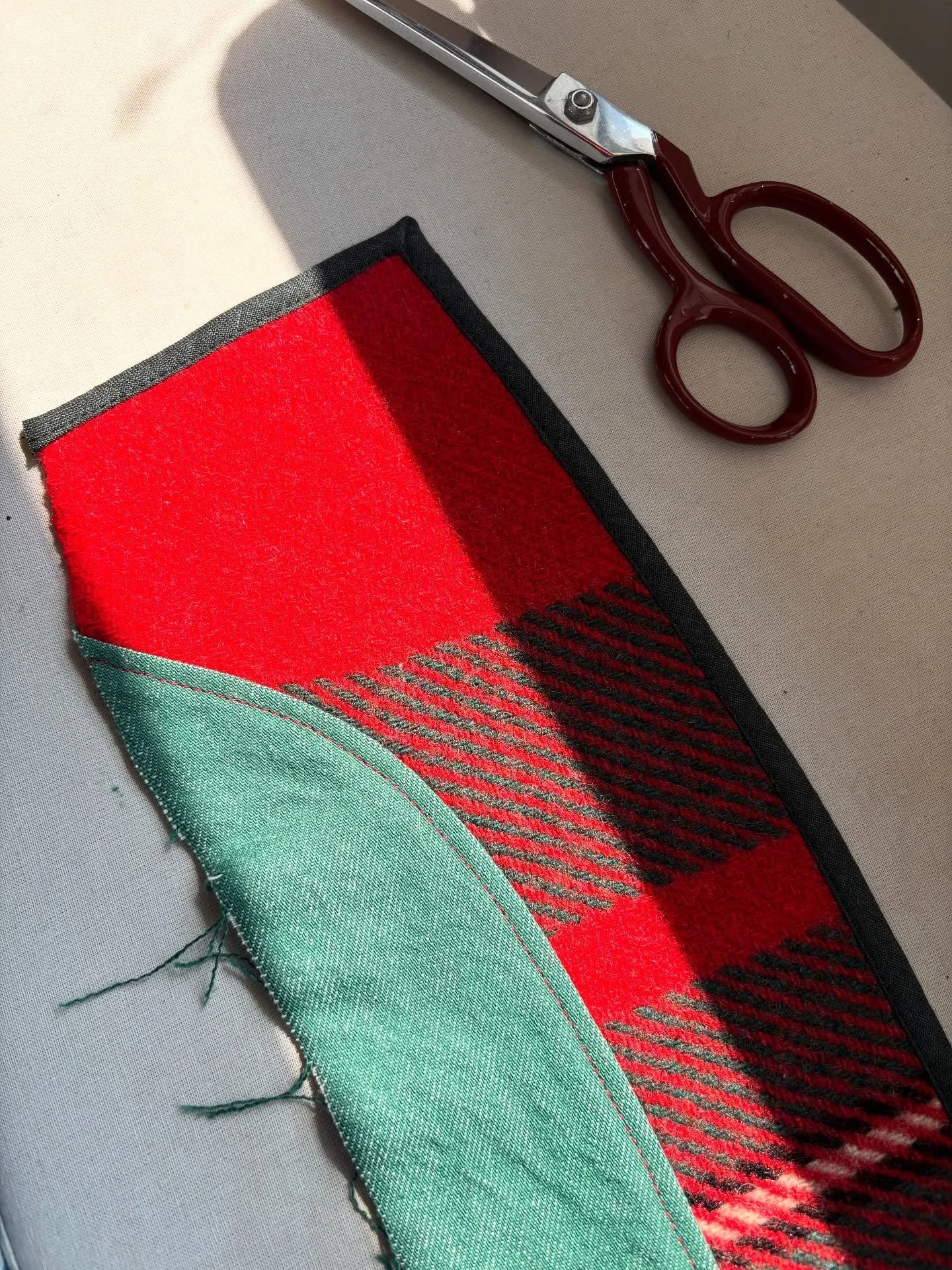 Some very satisfying details on the work bench this week. 
I&rsquo;m using a preloved blanket, with offcuts of linen and denim from my stash for the binding, collar stand and button facing. Yes it takes a long time to dig through and find the right f