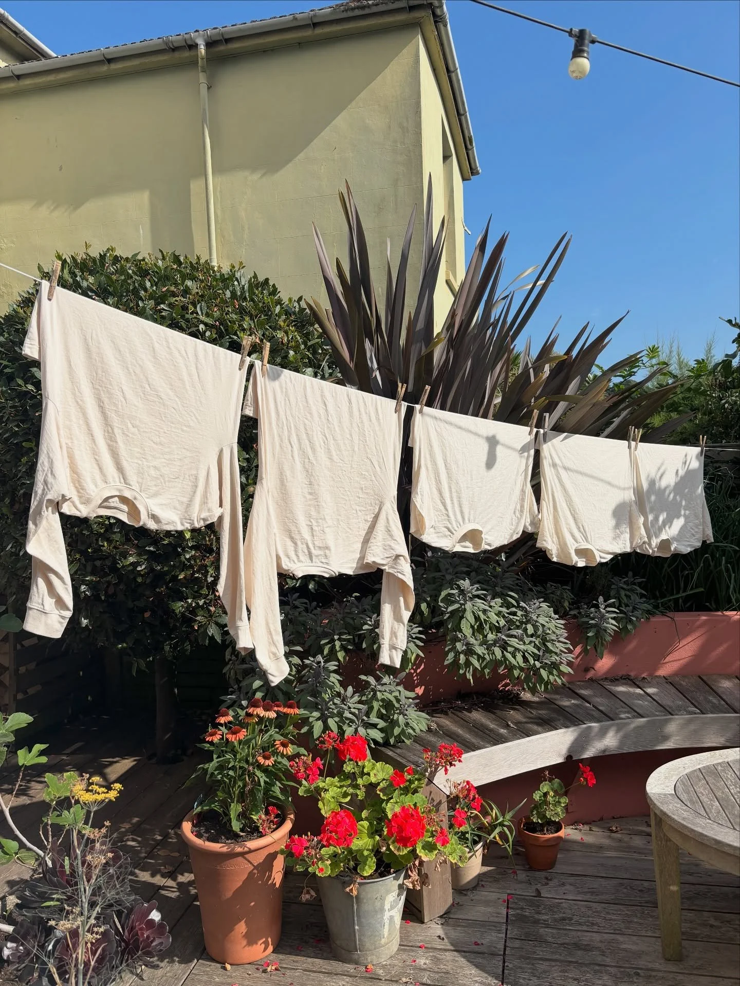 Perfect drying day for washing these gorgeous organic natural cotton tees to be used for new O Moon pieces 🤍